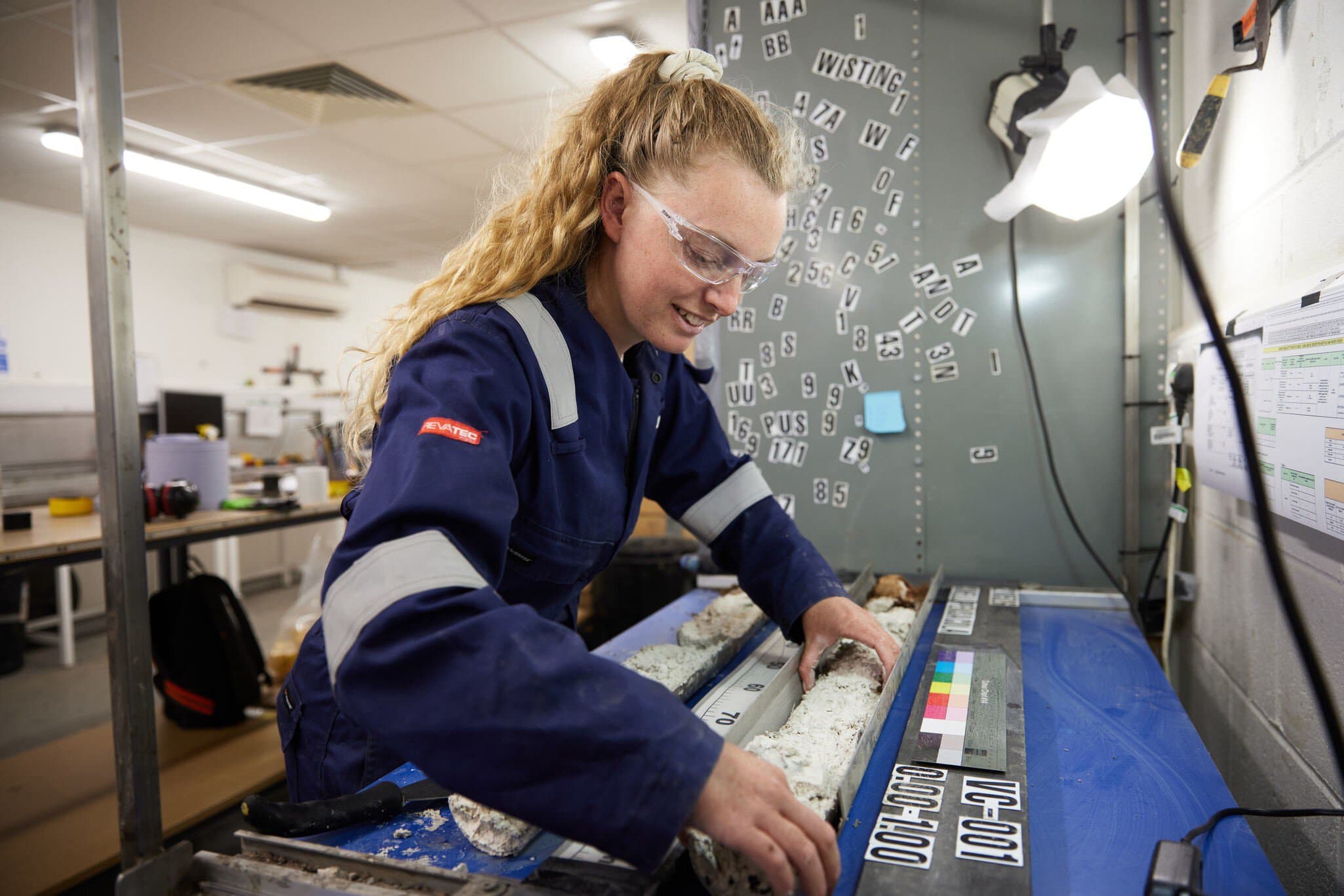 Employees performing core logging in geotechnical laboratory in Wallingford
