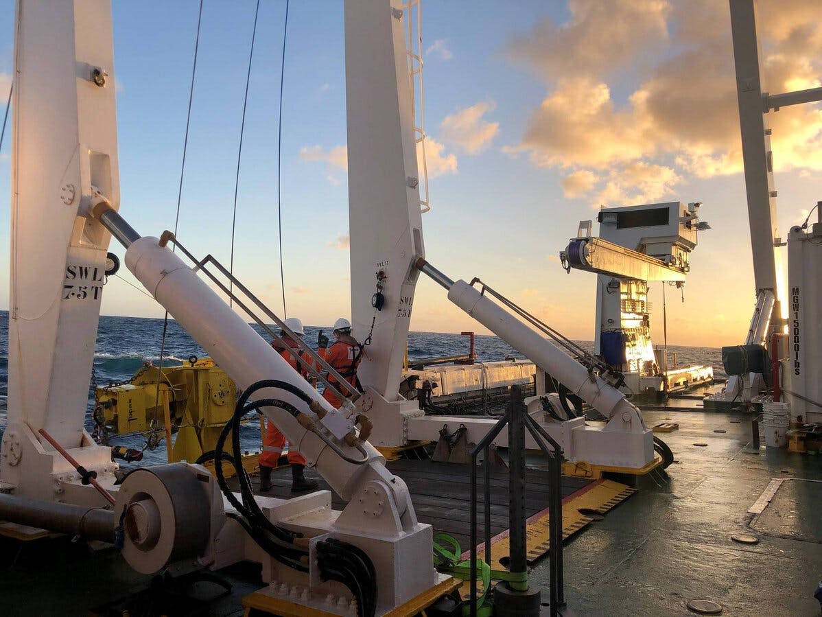 Fugro employees working on the back deck during an offshore seep study in Suriname